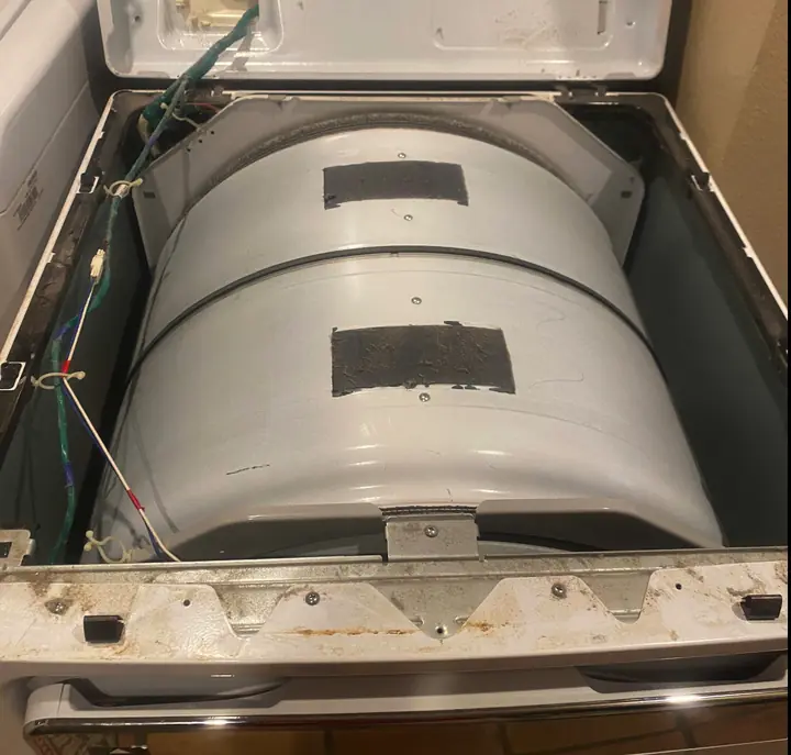 Dryer Drum & Belt Service: We lifted the top panel to expose the drum, belt path and wiring, then inspected the glides, felt seals and belt
