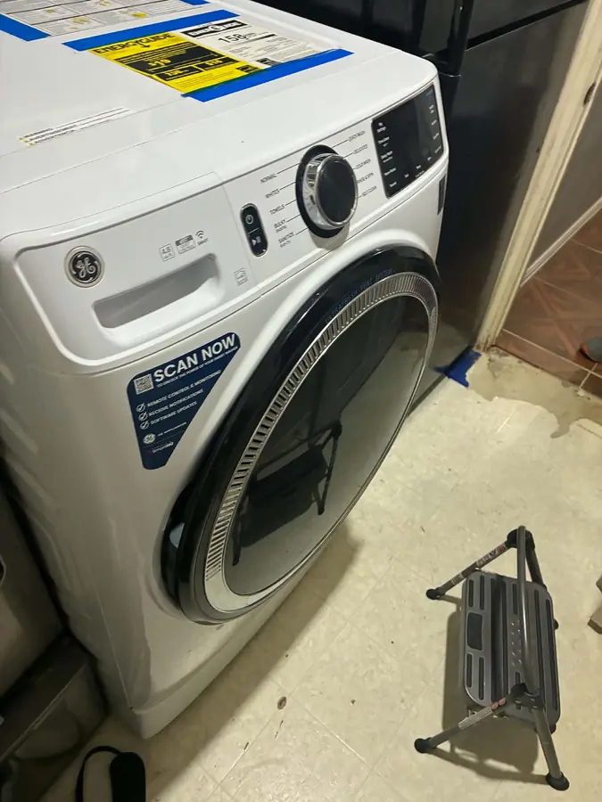 GE Front-Load Washer Leak Diagnosis: Water was pooling in front of a newer GE front-load washer