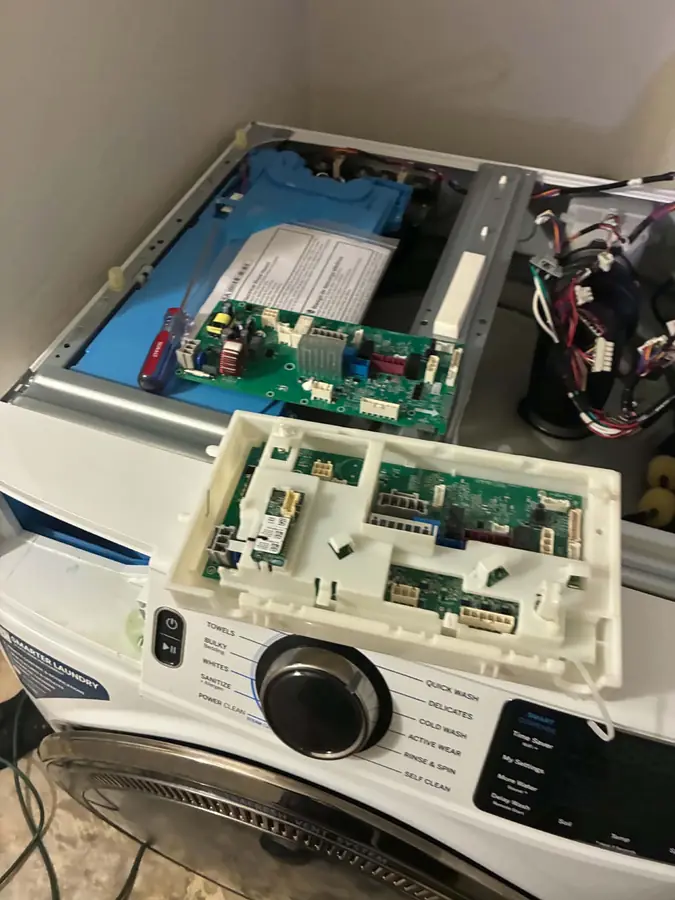 GE Washer Control Board Replacement: We opened the control panel to replace the main electronic board on a GE front-load washer