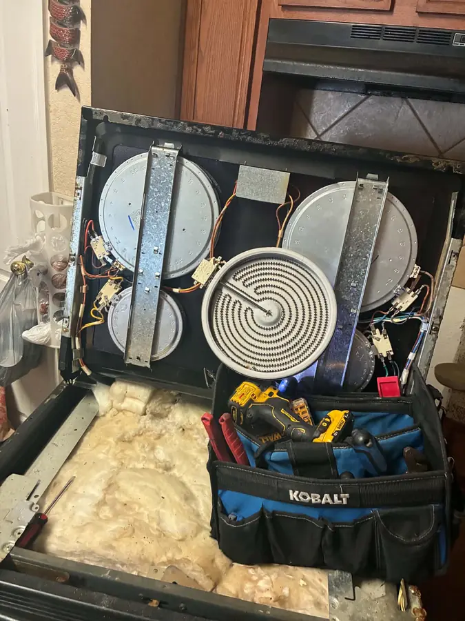 Glass-Top Range Radiant Element Repair: We lifted the glass cooktop to reach the radiant elements, limit switches and wiring